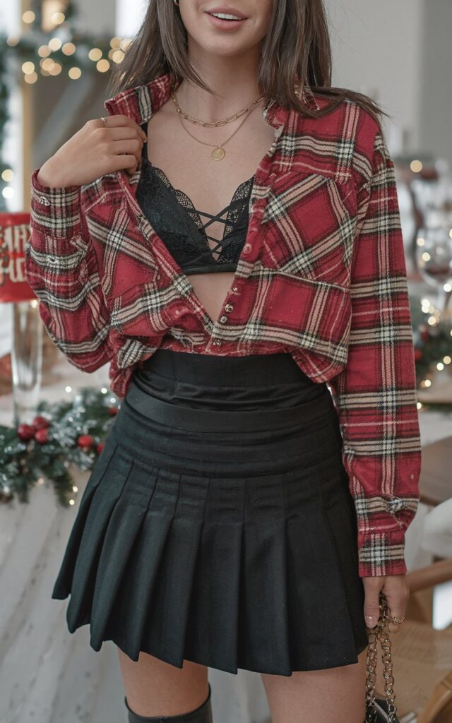 A natural-looking young woman wearing a chic outfit styled with heeled boots. Theme holiday party outfit