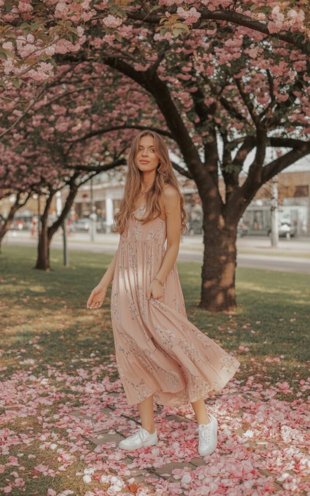 A natural-looking young woman wearing a casual maxi dress styled with sneakers or ballet flats. Theme valentines day outfits